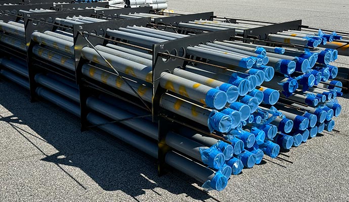 Conduit pipes with spacers and protective caps Conduit pipes with spacers and protective caps