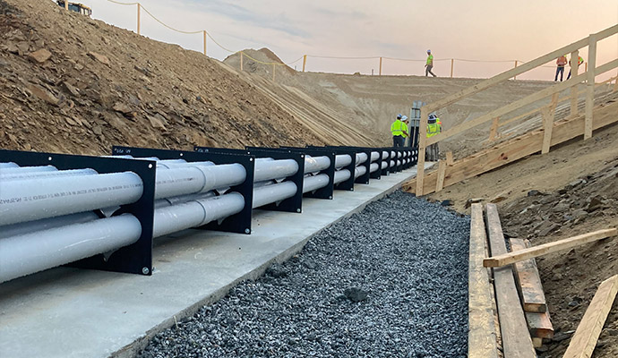 Experts installing duct bank spacer