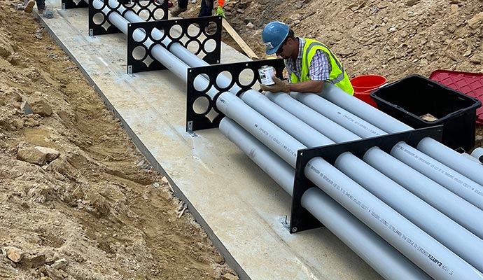 Underground conduit spacers installation